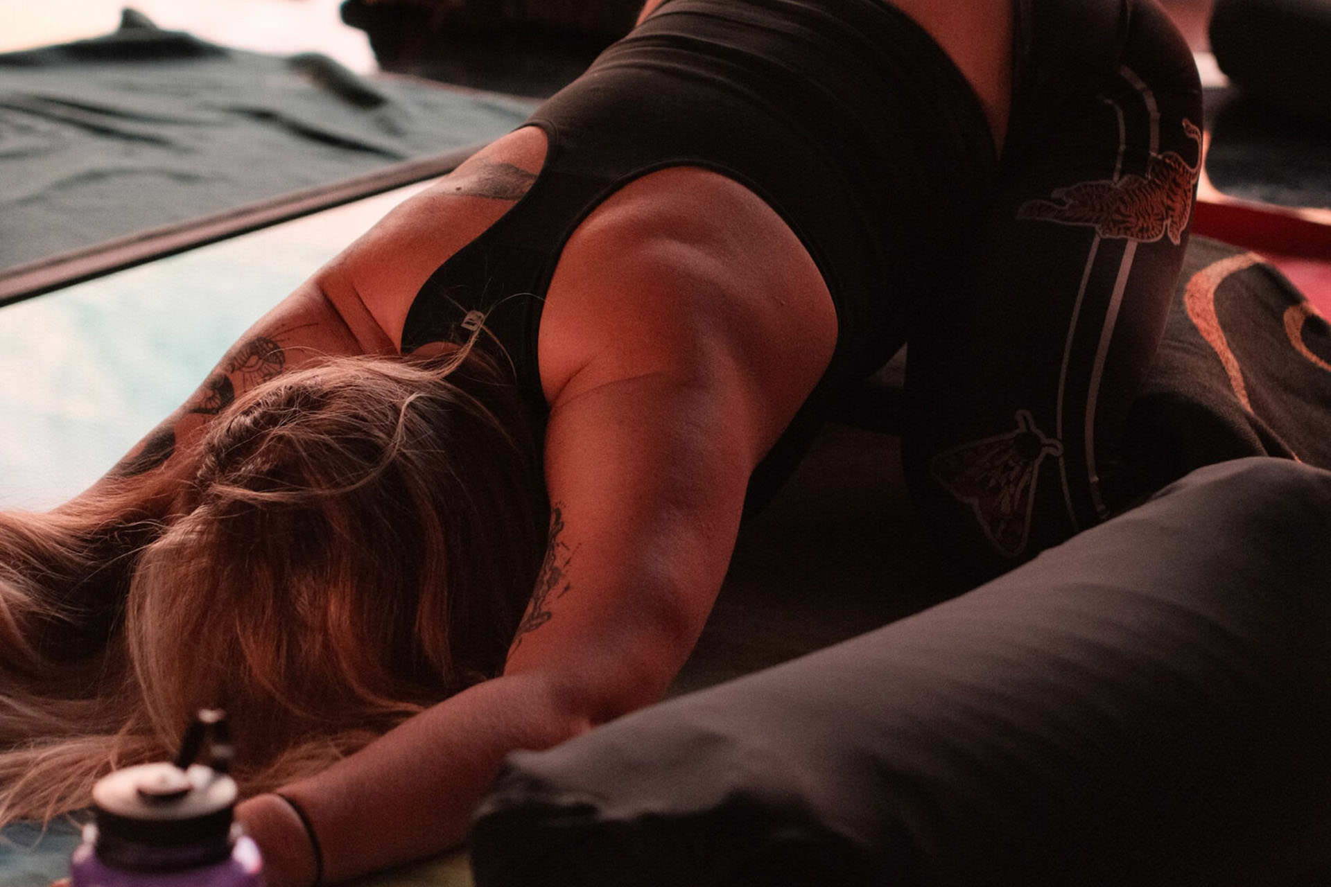 Student in a restorative Earth Yin pose at Namaste Yoga Scottsdale